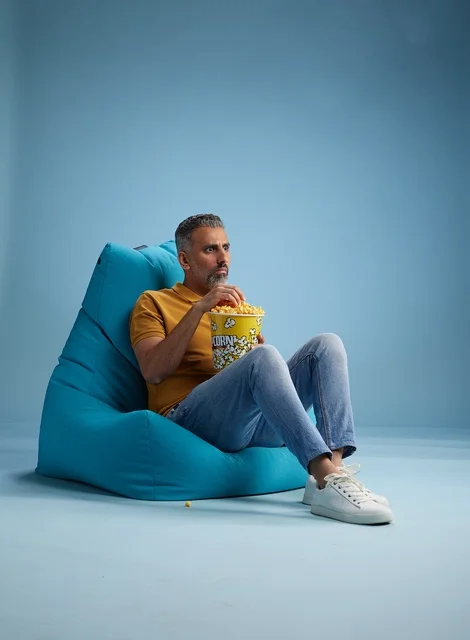 Saudi Man Eating Popcorn in Bean Bag Chair