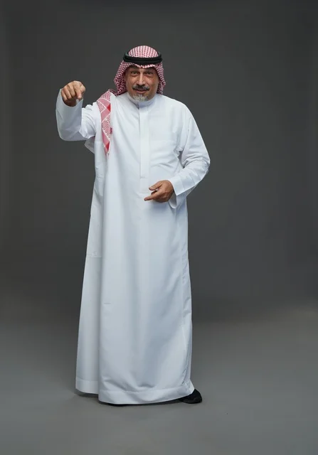 Saudi Man in Traditional Clothing Pointing in Studio