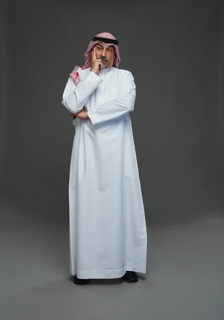 Saudi Man in Traditional Dress Thinking in Studio