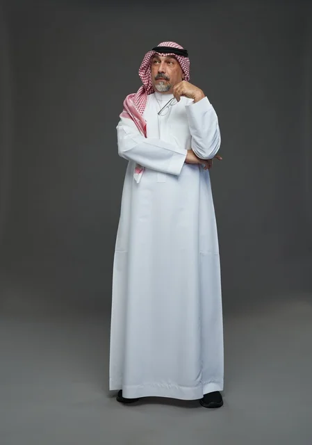 Saudi Man in Traditional Dress Thinking in Studio