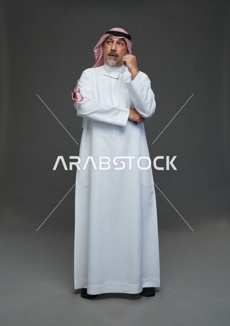 Saudi Man in Traditional Dress Thinking in Studio