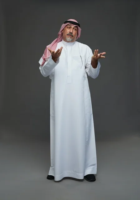 Saudi Man in Traditional Dress with Questioning Gesture