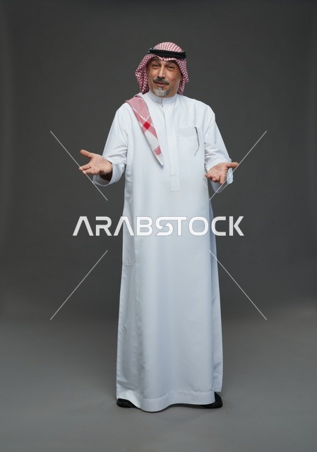 Saudi Man in Traditional Dress Gesturing in Studio