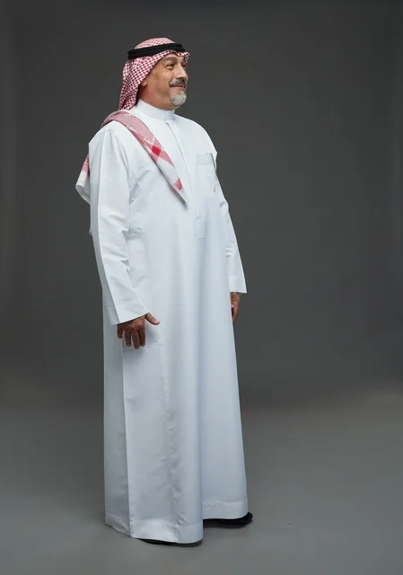 Saudi Man in Traditional White Thobe and Shemagh