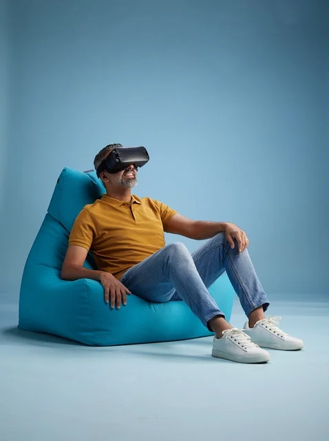 Saudi Man Using VR Headset on Beanbag Chair