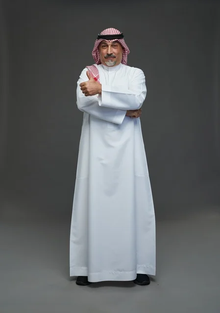 Saudi Man in Traditional Dress Giving Thumbs Up