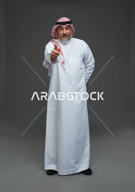 Saudi Man in Traditional Dress Thumbs Up Gesture