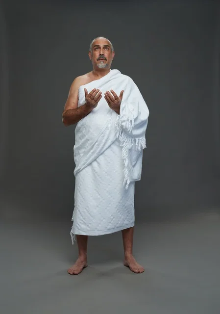 Saudi Man in Ihram Praying Hajj Umrah Rituals
