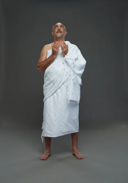 Saudi Man in Ihram Clothing Praying Hajj Umrah Rituals