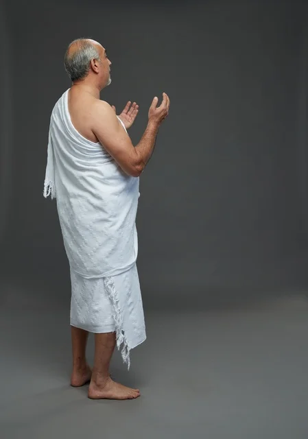 Saudi Man in Ihram Praying During Hajj Rituals
