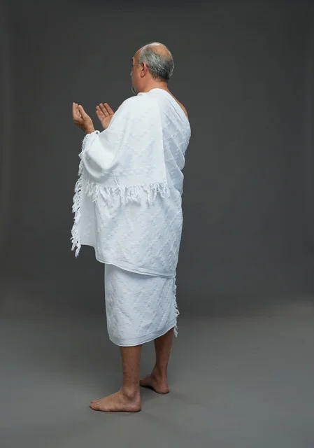 Saudi Man in Ihram Clothes Praying Hajj Rituals