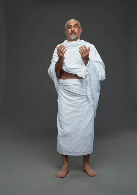 Saudi Man in Ihram Clothing Praying Hajj Pilgrimage Rituals