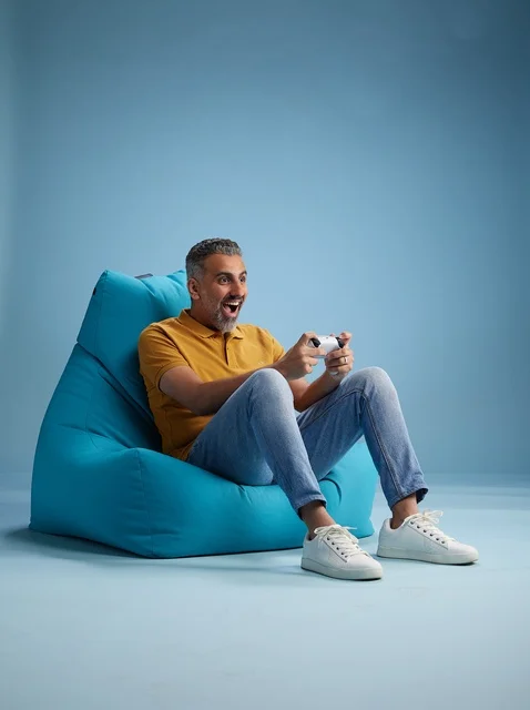 Saudi Man Playing Video Games on Bean Bag Chair