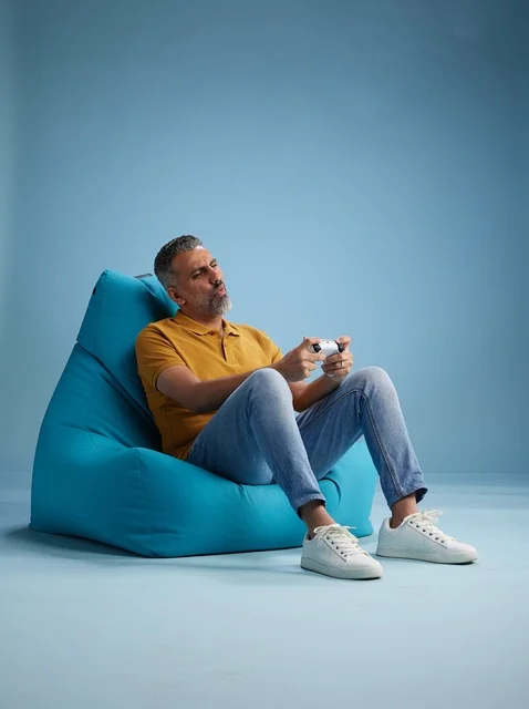 Saudi Man Playing Video Games on Beanbag Chair