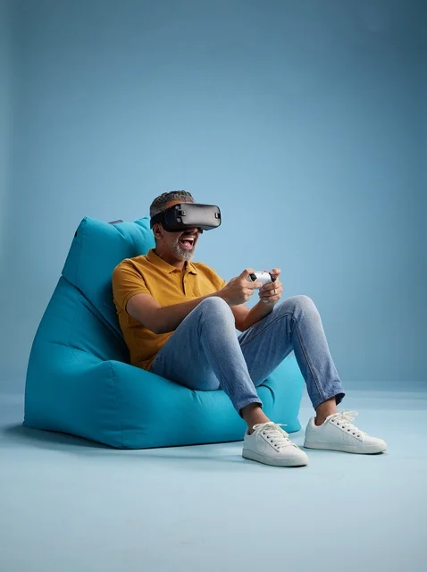 Saudi Man Playing Virtual Reality Games on Bean Bag