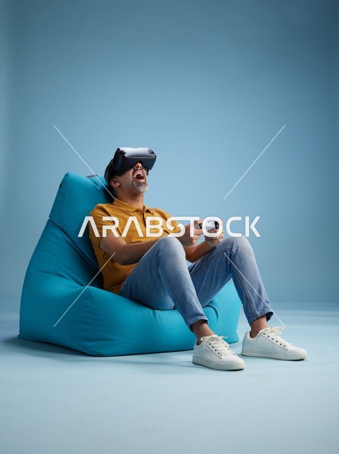 Saudi Man Using Virtual Reality Headset on Bean Bag