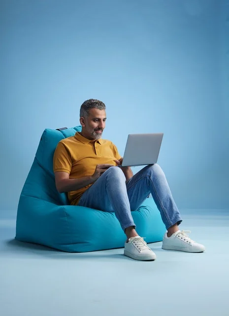 Saudi Man Working on Laptop in Studio