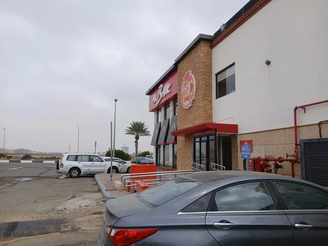 Al Baik Restaurant Exterior and Parking in Saudi Arabia