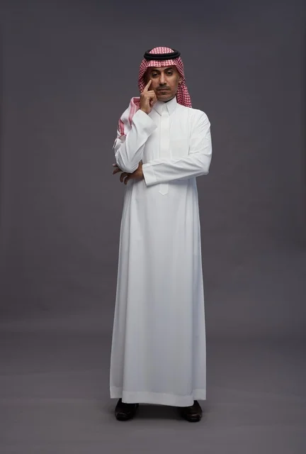 Saudi Man in Traditional Thobe Thinking Studio Shot
