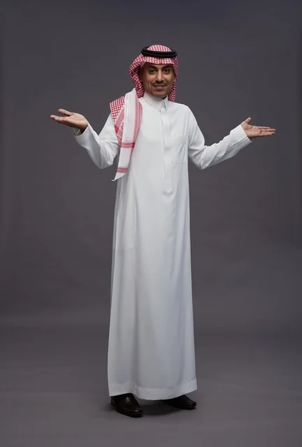 Saudi Man in Traditional Dress with Open Arms
