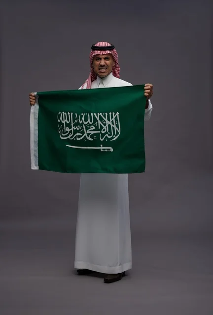 Saudi Man Holding Saudi Arabia Flag on National Day - Photo