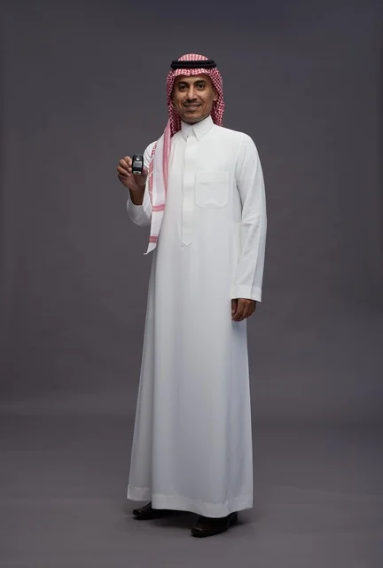 Saudi Man in Traditional Dress Holding Car Key Studio