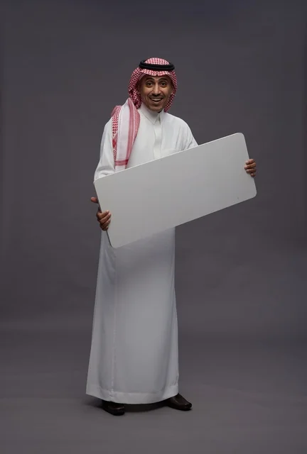 Saudi Man Holding Blank White Board in Studio