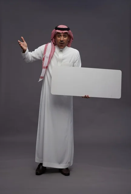 Saudi Man Holding Blank White Board in Studio