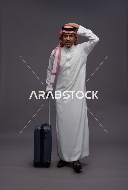Saudi Man in Traditional Dress with Travel Suitcase