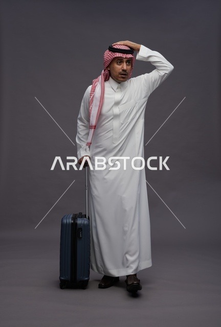 Saudi Man with Suitcase Expressing Confusion