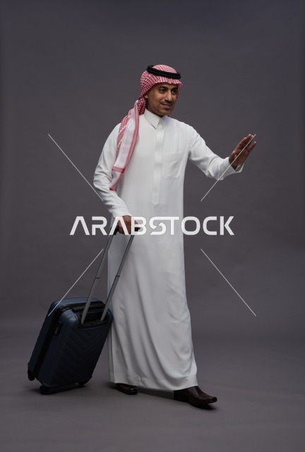 Saudi Man in Traditional Thobe with Travel Suitcase