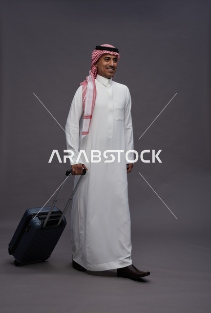 Saudi Man in Traditional Thobe with Travel Suitcase