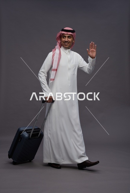 Saudi Man in Traditional Dress with Travel Suitcase