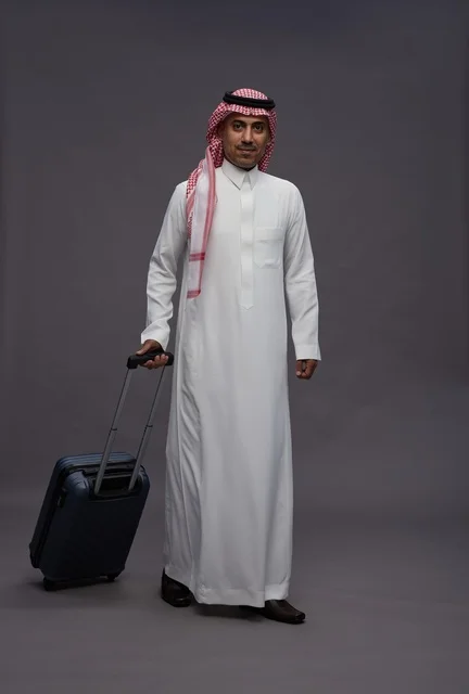 Saudi Man in Traditional Thobe with Travel Suitcase