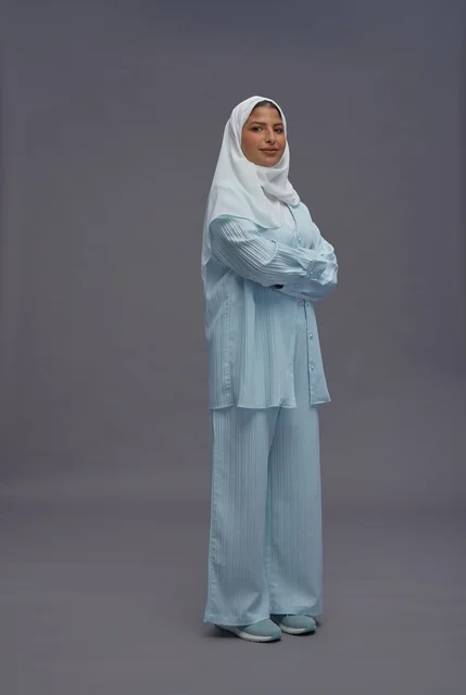 Saudi Woman in Modest Casual Wear Standing in Studio