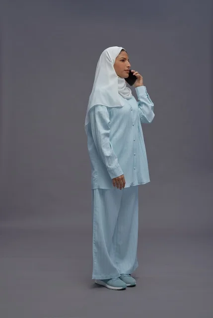 Saudi Woman in Hijab Talking on Smartphone Studio