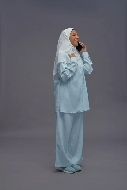 Saudi Woman in Hijab Talking on Smartphone