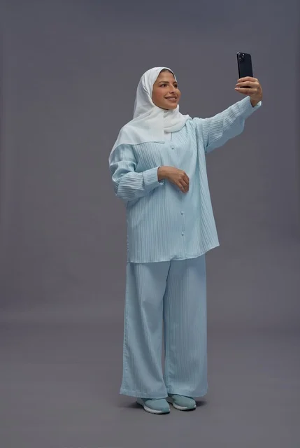 Saudi Woman in Hijab Taking Selfie in Studio
