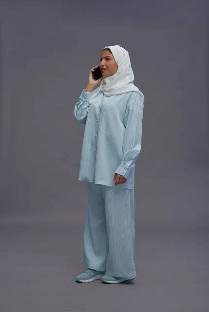 Saudi Woman in Hijab Talking on Smartphone Studio Shot