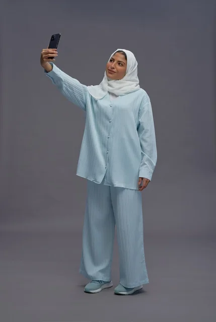 Saudi Woman in Hijab Taking Selfie in Studio