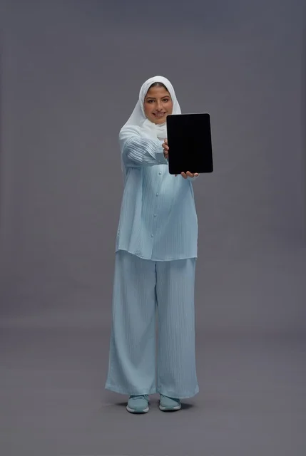 Saudi Woman in Hijab Holding Digital Tablet Studio