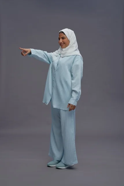 Saudi Woman in Blue Casual Wear Pointing Aside