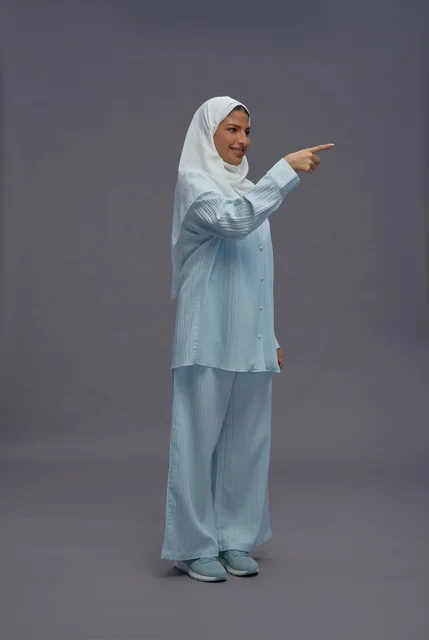 Saudi Woman in Blue Casual Outfit Pointing Finger