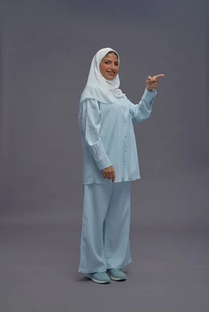 Saudi Woman in Hijab Pointing in Studio