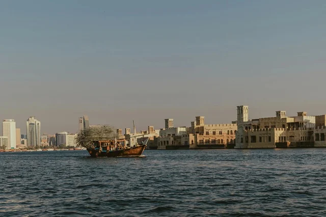 Traditional Dhow Boat at Dubai Creek UAE Skyline