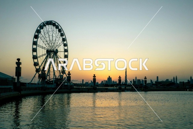 Dubai Skyline Ferris Wheel and Burj Khalifa at Sunset