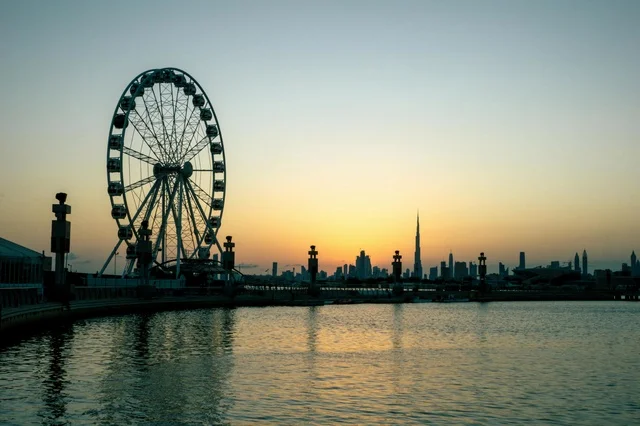 Dubai Skyline Ferris Wheel and Burj Khalifa at Sunset