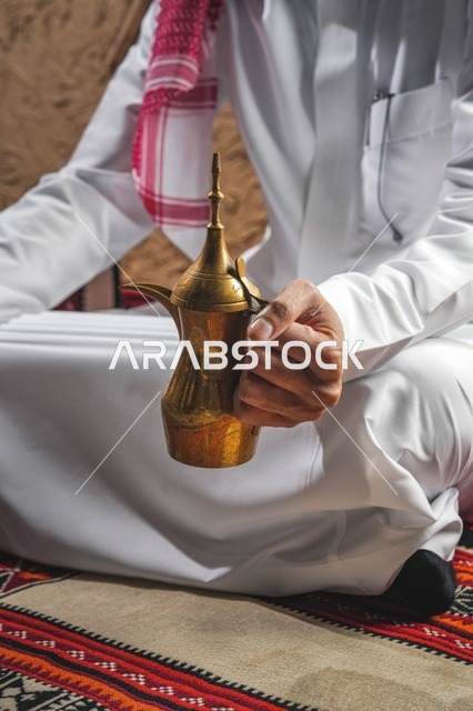 Saudi Man Holding Traditional Dallah Coffee Pot
