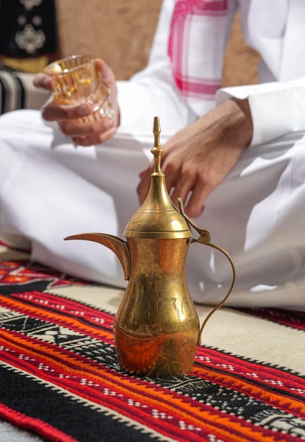 Traditional Saudi Dallah Coffee Pot on Sadu Rug