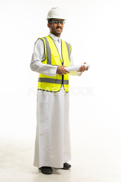 Saudi Engineer in Safety Gear Holding Blueprints